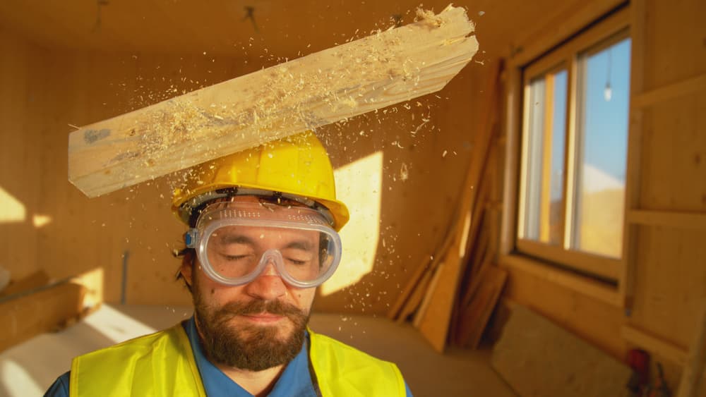 Wooden board falls on a young worker's head